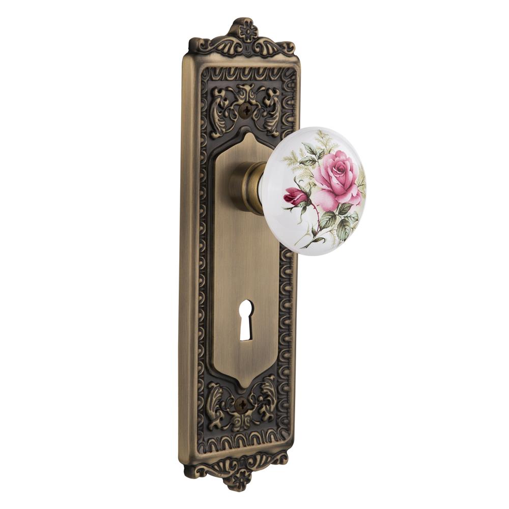 Nostalgic Warehouse EADROS Privacy Knob Egg and Dart Plate with Rose Porcelain Knob with Keyhole in Antique Brass